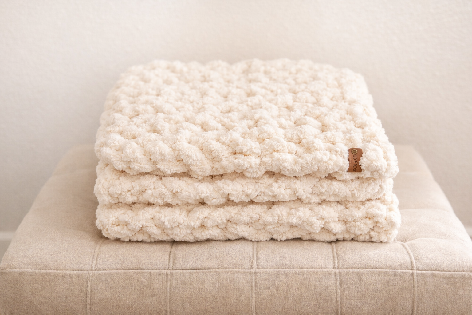 Stone chunky chenille knit blanket 30x40 styled on neutral close texture